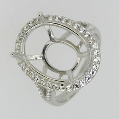 Sterling silver semi mount ring setting featuring an oval shape and white topaz halo, designed for custom gemstone placement.