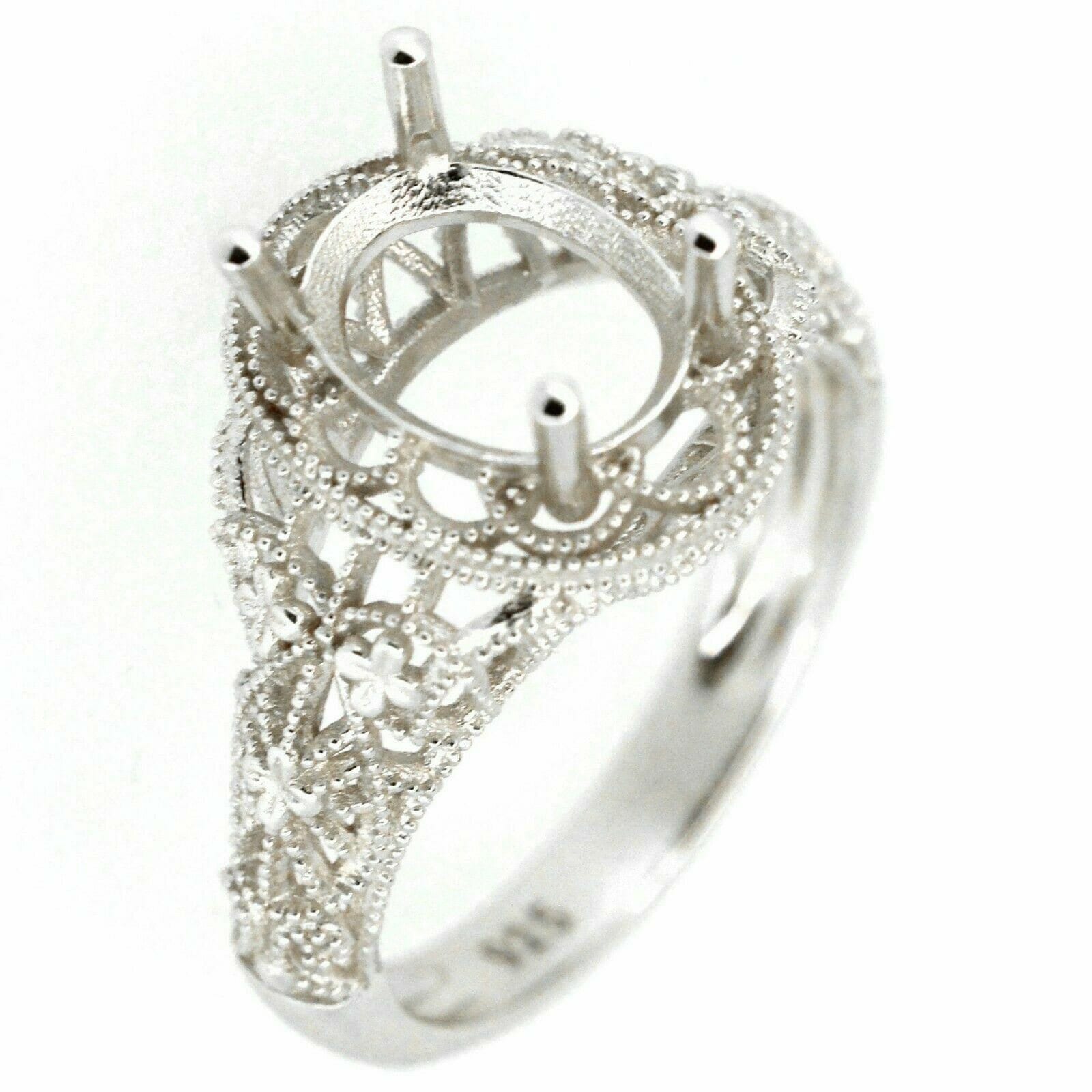 Sterling silver semi mount ring setting in art Nouveau style with intricate scroll details, designed for a 9x7mm gemstone.
