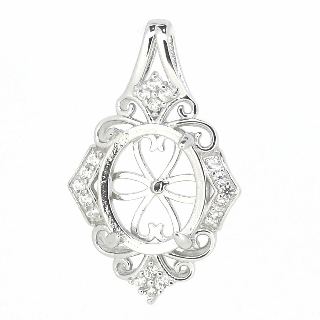 Vintage sterling silver semi mount pendant setting for 12x10mm cabochon with white topaz accents.