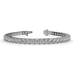 Custom sterling silver semi mount tennis bracelet setting with round clear stones and stainless steel tongue.