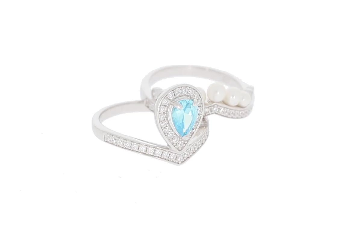 Pear Blue Topaz Sterling Silver Ring with Moissanite Accent