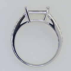 Sterling silver semi mount ring setting designed for an emerald with white topaz accents.