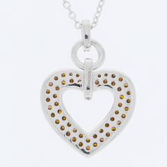Silver heart pendant necklace adorned with sparkling yellow gemstones, showcasing elegance and charm.