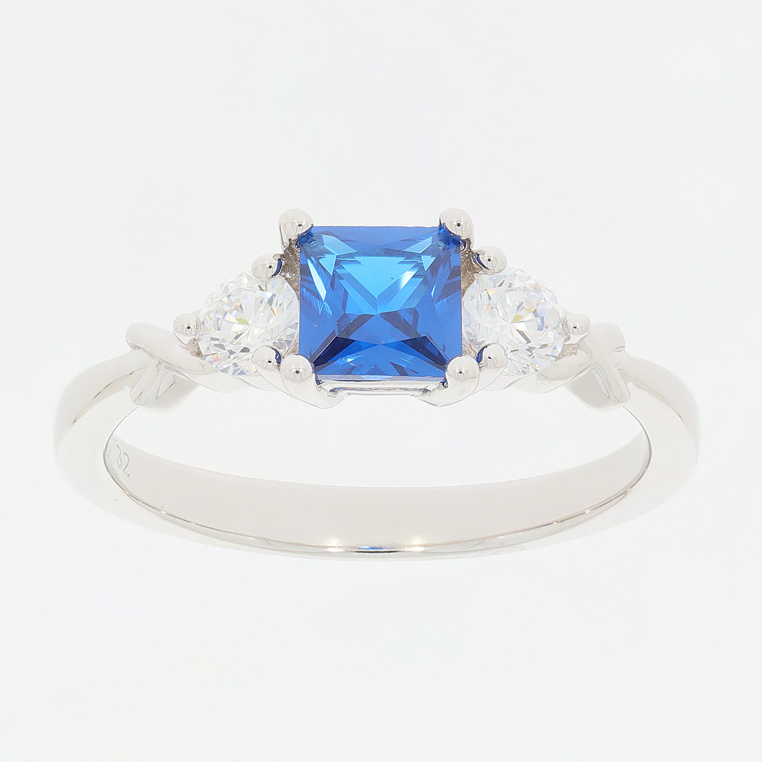 Princess blue moissanite sterling silver ring with sparkling moissanite accents.