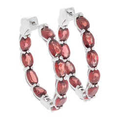 Oval red garnet sterling silver earrings featuring sparkling gemstones and an elegant design.