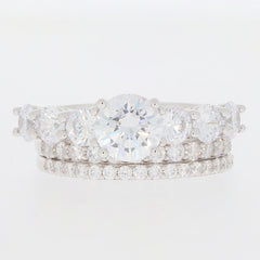 Elegant Round White Moissanite Sterling Silver Ring set, featuring sparkling gemstones and brilliant accents.