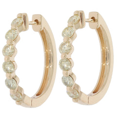 Elegant round green diamond 14K yellow gold earrings featuring sparkling gemstones in a chic hoop design.
