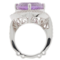 Trillion purple amethyst sterling silver ring showcasing intricate design and brilliant gemstone from a side view.