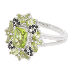 Cushion Green Peridot Sterling Silver Ring with black accent gemstones, elegant and eye-catching jewelry piece.