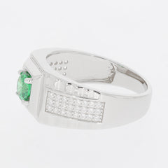 Round green emerald sterling silver ring with moissanite accents, showcasing elegant design and luxury craftsmanship.