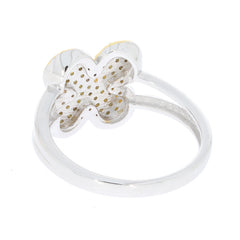 Elegant silver ring with a floral design and gold accents, showcasing a polished finish and intricate detailing.