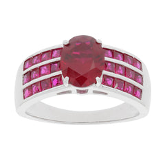 Oval red ruby sterling silver ring with ruby accent, featuring a central gemstone and dazzling side accents.