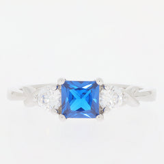 Princess Blue Moissanite sterling silver ring with Moissanite accents, showcasing elegance and luxury.