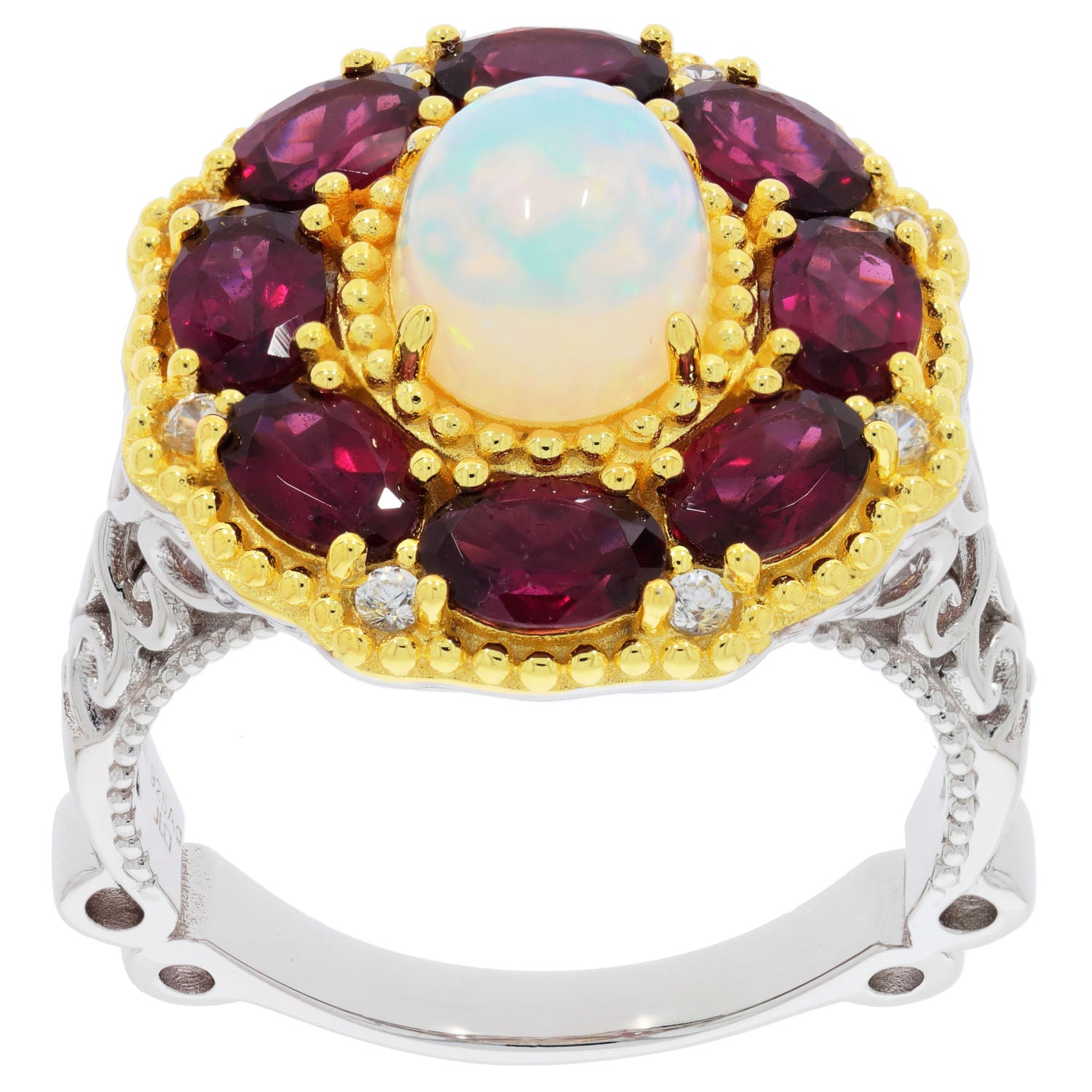 Elegant white opal sterling silver ring with accent garnets and gold detailing, showcasing exquisite craftsmanship.