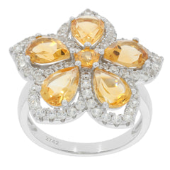 Elegant flower-shaped ring featuring pear yellow gemstones and sparkling accents in sterling silver.