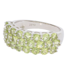 Elegant silver ring featuring a cluster of beautiful green gemstones, perfect for any sophisticated jewelry collection.