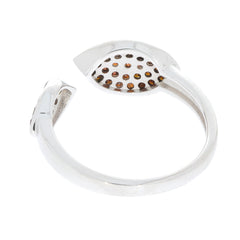 Elegant silver ring with a unique design featuring sparkling gemstones set in a circular pattern.