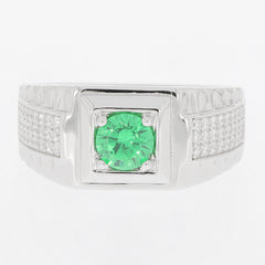Round green emerald sterling silver ring with moissanite accents highlighting elegance and luxury.