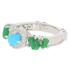 Blue turquoise sterling silver ring with green accents and sparkling gemstones, elegant and luxurious design.