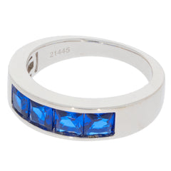 Blue Sapphire sterling silver ring with four sparkling gemstones, perfect for elegant style and luxury.