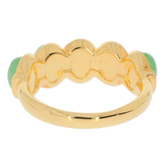 Back view of a luxurious gold ring featuring green jade accents, showcasing its elegant design and craftsmanship.