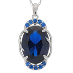 Oval blue sapphire sterling silver pendant with accent stones, showcasing elegance and luxury.