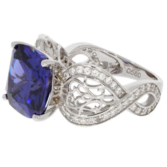 Blue sapphire sterling silver ring with intricate design and sparkling accents, perfect for elegant jewelry collections.