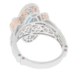 Elegant Blue London Topaz Sterling Silver Ring showcasing intricate design and warm accent details.