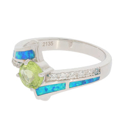 Green Peridot sterling silver ring with diamond accent and blue opal inlay, showcasing elegance and style.