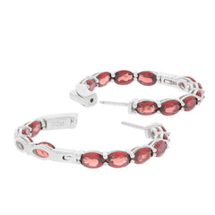 Elegant oval red garnet sterling silver earrings, perfect for adding a touch of luxury to any outfit.