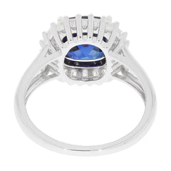 Elegant blue sapphire sterling silver ring showcasing a sparkling gemstone from a rear view, highlighting its intricate design.