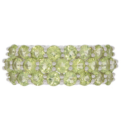 Elegant sterling silver ring featuring multiple round green gemstones in a stunning layered design.