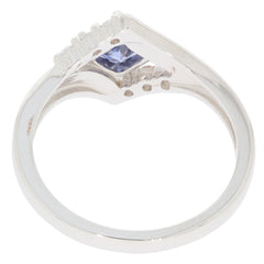 Blue Tanzanite sterling silver ring showcasing a sparkling gemstone and elegant design from the side view.