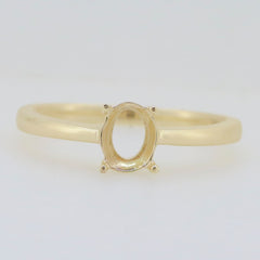 Custom sterling silver semi mount ring setting for 8x6mm oval gemstone in simple solitaire design.