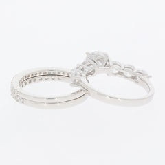 Elegant round white moissanite sterling silver ring set with accents, showcasing luxurious sparkle and timeless beauty.