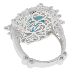 Oval blue turquoise sterling silver ring with sapphire accent, showcasing elegant filigree design.