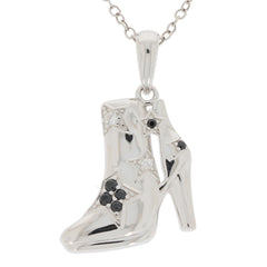 Stylish silver pendant in the shape of a high-heeled boot, adorned with black diamonds and sparkling accents.