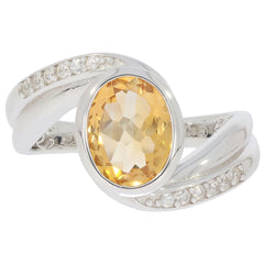 Elegant oval yellow citrine sterling silver ring with moissanite accents, perfect for sophisticated style.