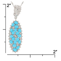 Elegant blue turquoise sterling silver pendant with moissanite accents, measuring 2 inches.