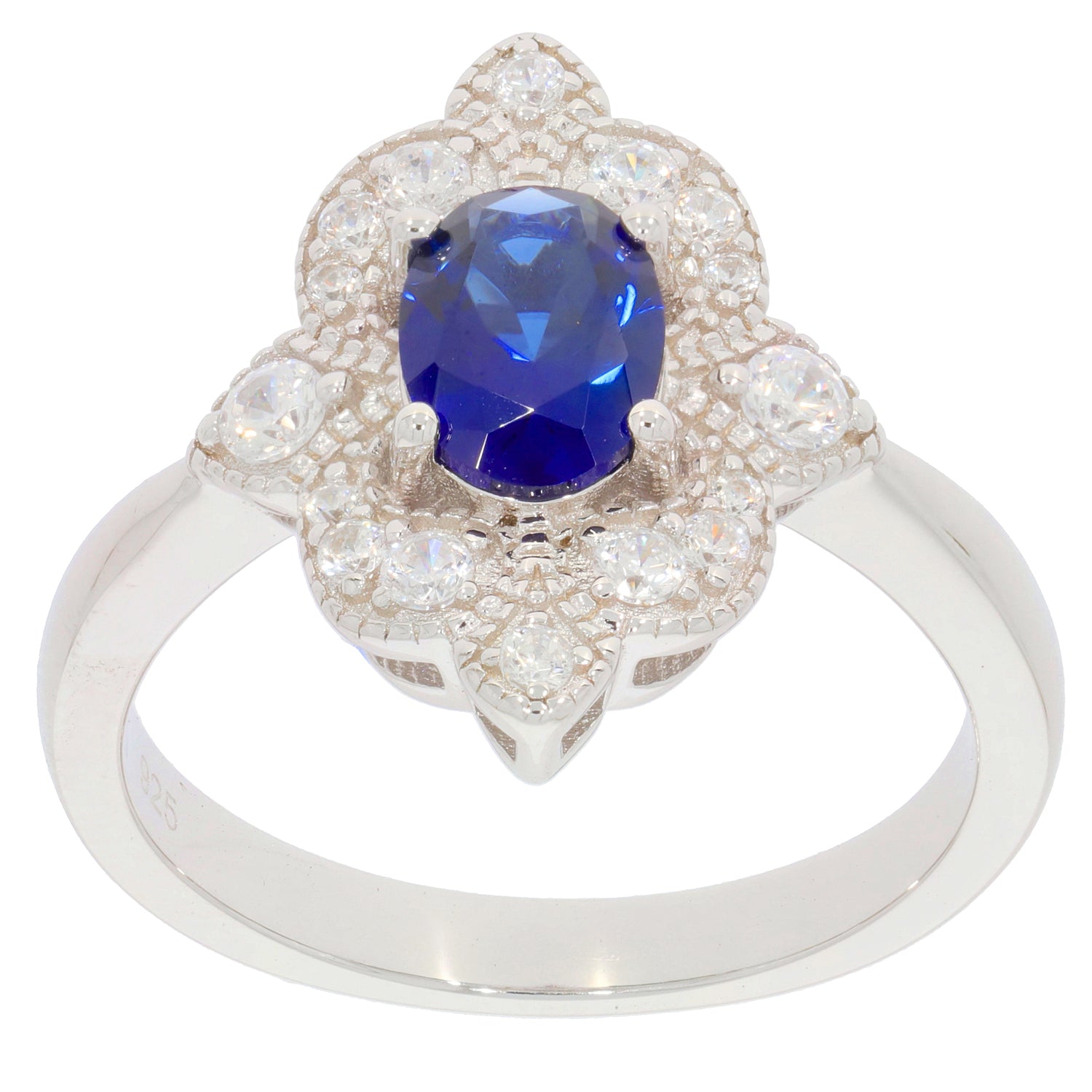 Blue sapphire sterling silver ring with accent stones in an elegant floral design, showcasing luxury and sophistication.