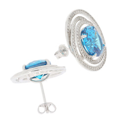 Elegant Blue Topaz Sterling Silver Earrings with Moissanite accents, featuring a stunning oval-cut blue gemstone.