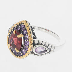 Pear Red Garnet Sterling Silver Ring with Amethyst accents, featuring intricate design and luxury appeal.