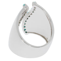 Back view of a blue turquoise sterling silver ring with accent, showcasing its elegant design and sparkling gemstones.