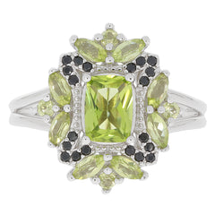 Cushion green peridot sterling silver ring with black accent gemstones, showcasing a brilliant design.