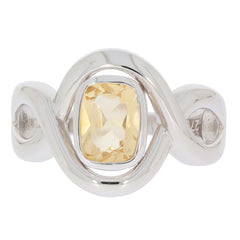 Sterling silver ring featuring a cushion-cut yellow gemstone, elegantly twisted design for a modern aesthetic.