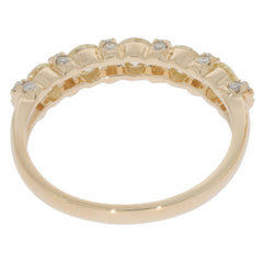 Round green diamond 14K yellow gold ring featuring sparkling accent stones, designed for elegant style.