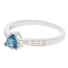 Trillion blue topaz sterling silver ring with accent stones, showcasing elegance and luxury in jewelry.