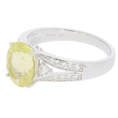 Oval yellow Heliodor sterling silver ring with accent stones, showcasing luxury and elegance.