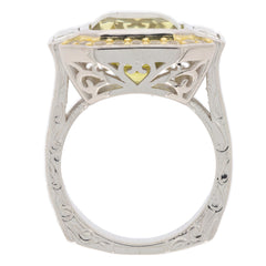 Emerald yellow lemon quartz sterling silver ring with intricate design and sparkling gemstone accent.