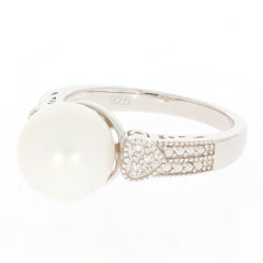 White pearl sterling silver ring with Moissanite accent, showcasing elegant design and timeless beauty.